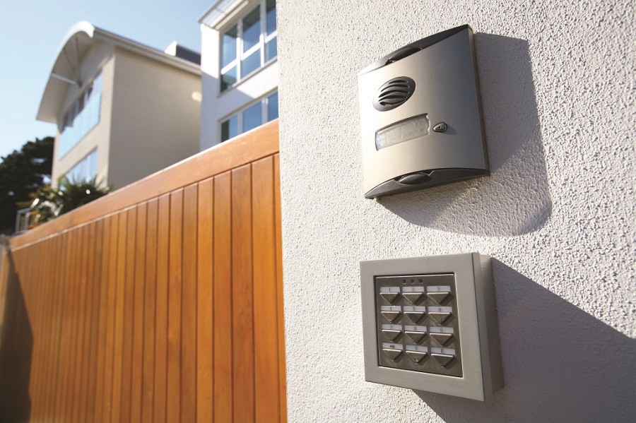 an access control keypad and intercom outside of a home’s security gate.